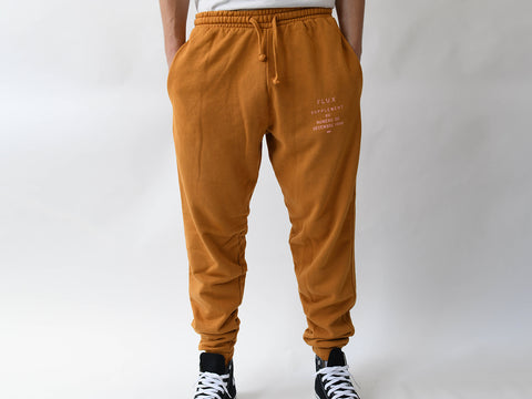 SUPPLEMENT TRACK PANT. MUSTARD